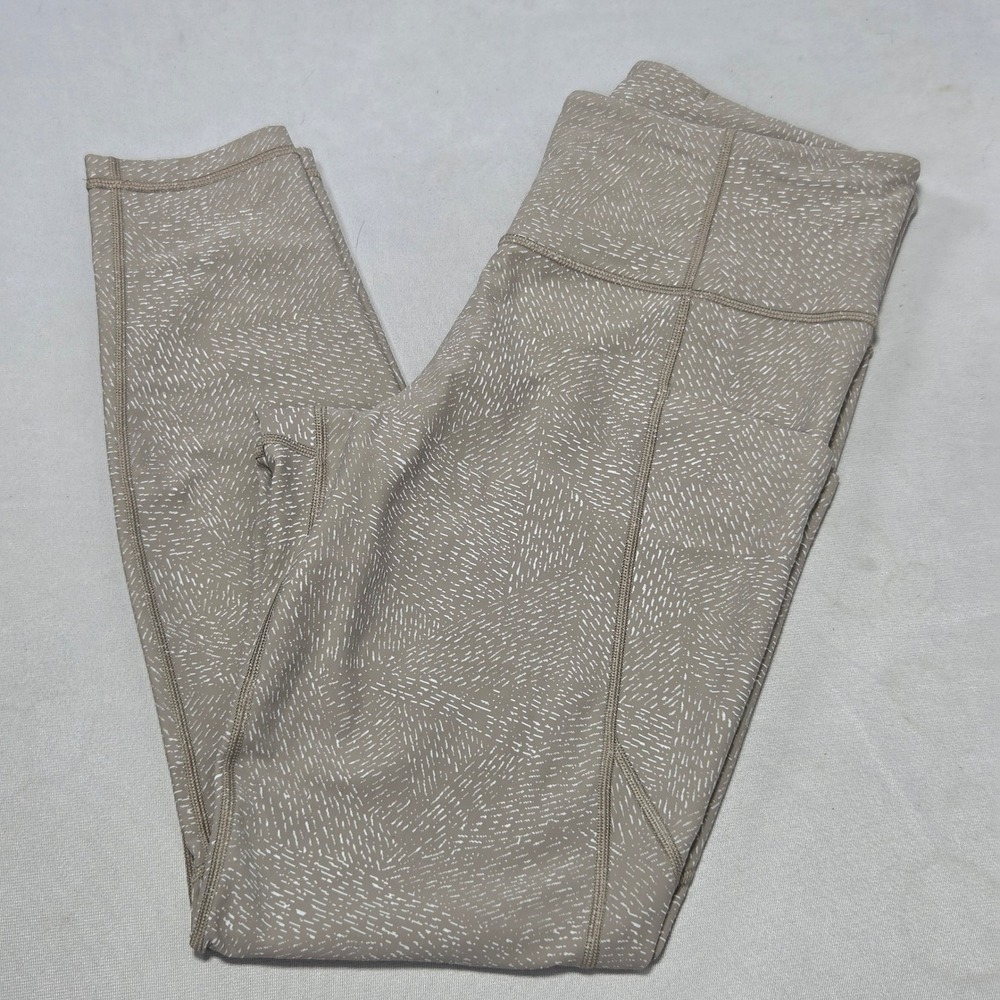 Athleta Salutation Stash Pocket Tight Leggings Tan White Dash Print Womens M